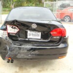 Photographs of a damaged Volkswagen Jetta that was repaired by Elite Paint & Body Shop in West Palm Beach Florida